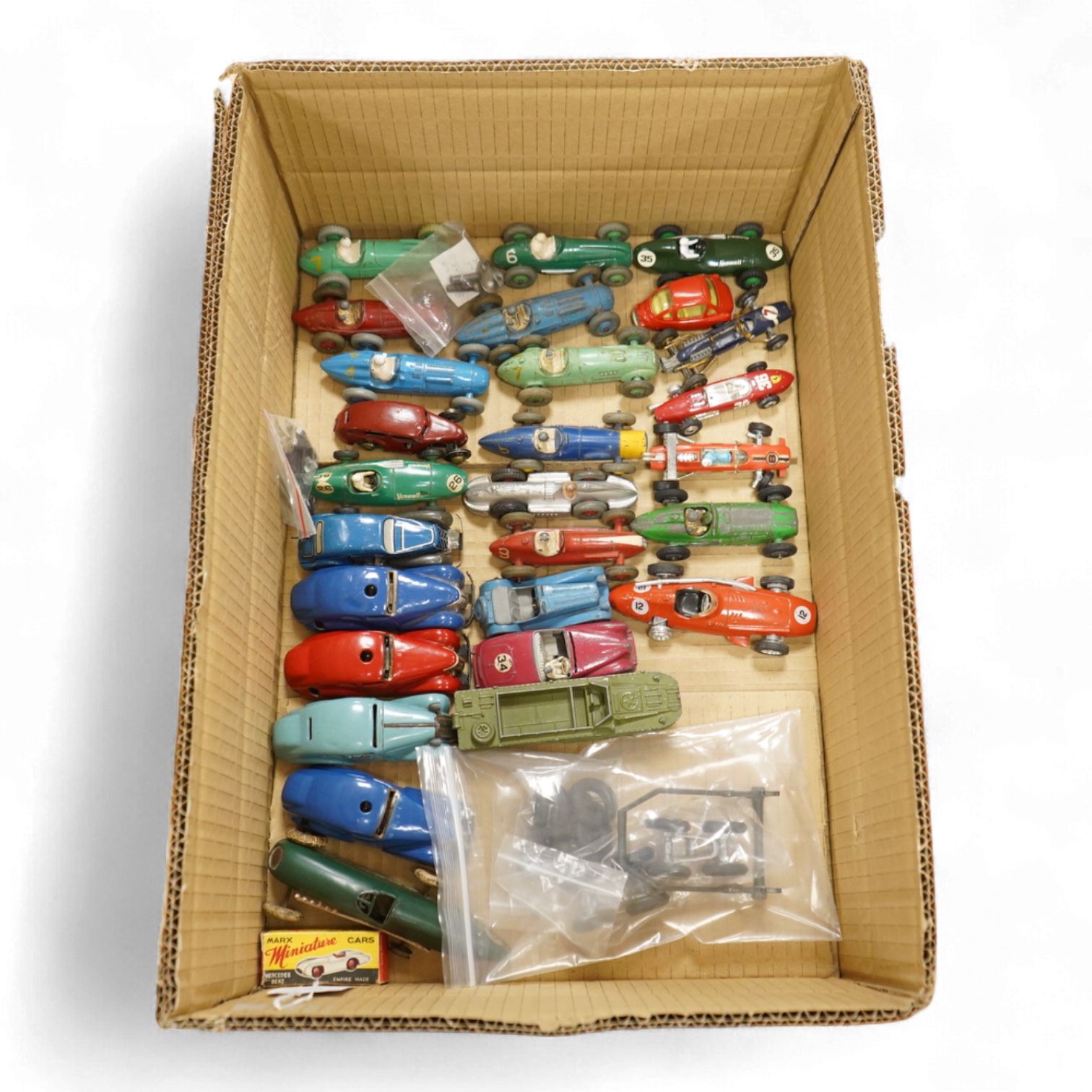 Twenty-eight diecast and tinplate vehicles by Dinky Toys, Schuco, Crescent, Corgi Toys, etc., including a good selection of single seat racing cars, three Schuco telesteering cars, etc.